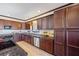 Modern kitchen equipped with granite countertops, stainless steel appliances, and sleek dark wood cabinets at 1650 Old Loganville Rd, Loganville, GA 30052