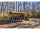 View of shed area surrounded by trees at 1650 Old Loganville Rd, Loganville, GA 30052