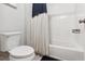 Clean, bright bathroom with a tub, toilet, and neutral decor at 258 Dawson Dr, Woodstock, GA 30188