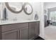 Stylish bathroom with double vanity, marble countertops, and sleek fixtures at 258 Dawson Dr, Woodstock, GA 30188