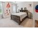 Comfortable bedroom with a ceiling fan and a large picture on the wall at 258 Dawson Dr, Woodstock, GA 30188