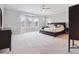 Spacious main bedroom featuring a large bay window and a ceiling fan at 258 Dawson Dr, Woodstock, GA 30188