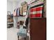 Organized walk-in closet featuring hanging clothes, shoe racks, and cabinet space at 258 Dawson Dr, Woodstock, GA 30188