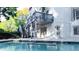 Backyard view showcasing the pool, deck, patio, and lush greenery at 3258 Bransley Way, Duluth, GA 30097