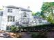 Exterior backyard view featuring a lush lawn, patio, and multi-level deck at 3258 Bransley Way, Duluth, GA 30097