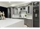 Basement bar featuring elegant gray cabinetry and shelves at 3258 Bransley Way, Duluth, GA 30097