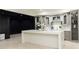 Basement bar featuring a modern island with elegant gray cabinetry and shelves at 3258 Bransley Way, Duluth, GA 30097