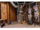 Unfinished basement featuring a furnace and two water heaters on a concrete slab at 3258 Bransley Way, Duluth, GA 30097
