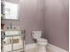 A stylish powder room features a mirrored vanity and modern fixtures at 3258 Bransley Way, Duluth, GA 30097