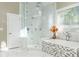 Elegant bathroom with glass shower, soaking tub, and marble finishes at 3258 Bransley Way, Duluth, GA 30097