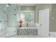 Luxurious bathroom features a soaking tub, glass-enclosed shower, and marble accents at 3258 Bransley Way, Duluth, GA 30097