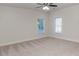 Bright bedroom features neutral carpet, ceiling fan, and natural light from the windows at 3258 Bransley Way, Duluth, GA 30097