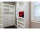 Well-organized closet with built-in shelving, drawers, and a window for natural light at 3258 Bransley Way, Duluth, GA 30097