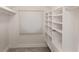 Walk-in closet with custom shelving and ample storage at 3258 Bransley Way, Duluth, GA 30097