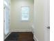 Bright entryway boasts natural light, wood floors, and a built-in bench at 3258 Bransley Way, Duluth, GA 30097