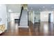 Open foyer featuring hardwood floors, elegant staircase, and seamless access to the rest of the house at 3258 Bransley Way, Duluth, GA 30097