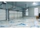 Spacious garage with epoxy floors, ample lighting, and garage doors at 3258 Bransley Way, Duluth, GA 30097