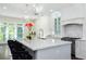 Bright and airy kitchen with marble countertops and seating at island at 3258 Bransley Way, Duluth, GA 30097