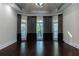 Living room with hardwood floors, recessed lighting, and large windows with designer drapes at 3258 Bransley Way, Duluth, GA 30097