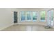 Living space with large windows, herringbone floors, and natural light at 3258 Bransley Way, Duluth, GA 30097