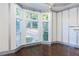 Bright and airy living room features a large bay window and decorative trim at 3258 Bransley Way, Duluth, GA 30097