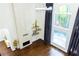 Sunlit living room with floor-to-ceiling windows and hardwood flooring at 3258 Bransley Way, Duluth, GA 30097