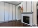 Cozy living room showcasing a decorative fireplace, unique wall design, and hardwood flooring at 3258 Bransley Way, Duluth, GA 30097