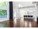 Spacious living room flowing into a bright kitchen, ideal for entertaining at 3258 Bransley Way, Duluth, GA 30097