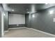 Well appointed media room featuring wall sconces and a large screen for immersive entertainment at 3258 Bransley Way, Duluth, GA 30097
