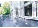 Spacious stone patio with gray railing and view of the backyard at 3258 Bransley Way, Duluth, GA 30097