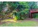 Beautiful backyard with mature trees and a view of the raised wooden deck at 3617 Summit Trce, Decatur, GA 30034