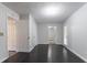 This bedroom features dark wood floors, neutral walls, a ceiling light, and two entryways at 3617 Summit Trce, Decatur, GA 30034