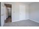 This bedroom has neutral walls and flooring, plus doors leading to other parts of the home at 3617 Summit Trce, Decatur, GA 30034