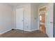 Bedroom featuring neutral carpet with open door to hallway and view to a second room at 3617 Summit Trce, Decatur, GA 30034