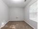 Bedroom with neutral carpet, light gray walls, and a window for natural light at 3617 Summit Trce, Decatur, GA 30034