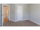 Bedroom features neutral carpet and a view into the hallway with wood floors at 3617 Summit Trce, Decatur, GA 30034