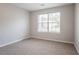 A bright bedroom with a large window providing plenty of natural light at 3617 Summit Trce, Decatur, GA 30034