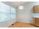 Bright dining area features hardwood floors, a large window, and a stylish light fixture at 3617 Summit Trce, Decatur, GA 30034