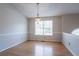 Empty dining room features hardwood floors, a chandelier, and bright lighting at 3617 Summit Trce, Decatur, GA 30034