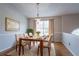 Dining room featuring a wood table with seating for four and a decorative chandelier at 3617 Summit Trce, Decatur, GA 30034