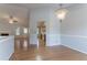 Open dining room offering hardwood floors and seamless access to the kitchen and living area at 3617 Summit Trce, Decatur, GA 30034