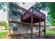 Exterior view of the home featuring a wood deck, concrete patio and vinyl siding at 3617 Summit Trce, Decatur, GA 30034