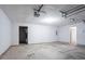 Spacious two-car garage with a concrete floor, white walls, and door to interior at 3617 Summit Trce, Decatur, GA 30034