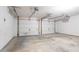 Spacious two-car garage with two overhead doors and a concrete floor at 3617 Summit Trce, Decatur, GA 30034
