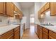 Galley kitchen featuring oak cabinets, laminate countertops, and white appliances at 3617 Summit Trce, Decatur, GA 30034