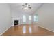 Bright living room features hardwood floors, a fireplace, and a ceiling fan at 3617 Summit Trce, Decatur, GA 30034