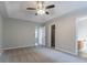 A spacious main bedroom with neutral gray walls, plush carpet, and a modern ceiling fan at 3617 Summit Trce, Decatur, GA 30034