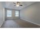 Main bedroom with ceiling fan and natural light from two windows at 3617 Summit Trce, Decatur, GA 30034