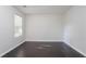 Room features dark laminate flooring, a window letting in natural light, and neutral paint at 3617 Summit Trce, Decatur, GA 30034