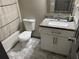This bathroom features a granite countertop, white cabinets, and a shower with a modern shower curtain at 4678 Browns Mill Ferry Rd, Lithonia, GA 30038